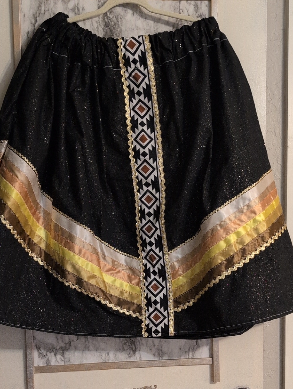 Black Metallic Glitter Native Ribbon Skirt with Gold & Yellow Trim.
